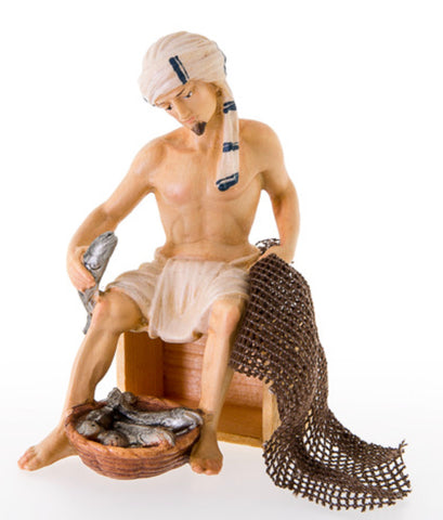 Nazarene Fisher Sitting on Wooden Case