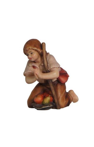 Heimatland Boy kneeling with stick