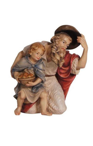 Heimatland Shepherd kneeling with boy